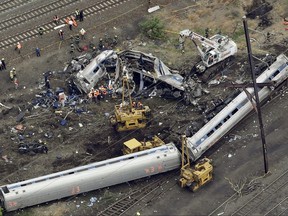 FILE - In this May 13, 2015, file photo, emergency personnel work at the scene of a derailment in Philadelphia of an Amtrak train headed to New York. A preliminary hearing is scheduled Tuesday, Sept. 12, 2017, for Brandon Bostian charged in a Philadelphia derailment that killed eight in 2015. (AP Photo/Patrick Semansky, File)