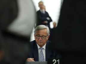 European Commission President Jean-Claude Juncker reads his notes before addressing the members of the European Parliament in Strasbourg, eastern France, to outline his reform plans for the European Union in the so-called State of the Union debate, Wednesday, Sept. 13, 2017. (AP Photo/Jean-Francois Badias)