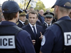 French President Emmanuel Macron meets with police officers, unhappy with their working conditions, in Lyon, central France, Thursday, Sept. 28, 2017. (AP Photo/Laurent Cipriani, Pool)