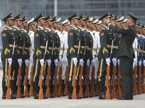 Chinese People's Liberation Army honor guard prepare for the arrival of Brazilian President Michel Temer at Xiamen Gaoqi International Airport to attend the upcoming BRICS Summit in Xiamen, China's Fujian province, Sunday, Sept. 3, 2017.   (Wu Hong/Pool Photo via AP)