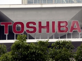 FILE - This May 26, 2017 file photo shows the company logo of Toshiba Corp. displayed in front of its headquarters in Tokyo. Toshiba's long meandering sale of its computer memory business is taking another turn, as the Japanese nuclear and electronics company's announcement of a deal with a consortium was immediately met with opposition from U.S. joint venture partner Western Digital. (AP Photo/Koji Sasahara, File)