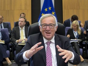 European Commission President Jean-Claude Juncker addresses the room during a meeting of the college of commissioners at EU headquarters in Brussels on Wednesday, Sept. 20, 2017. (AP Photo/Virginia Mayo)
