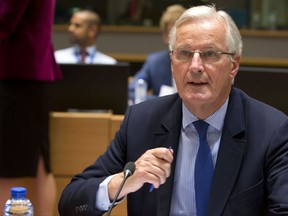 European Union chief Brexit negotiator Michel Barnier attends a meeting of EU General Affairs, Article 50, ministers in Brussels on Monday, Sept. 25, 2017. The European Union on Monday ramped up pressure on Britain ahead of a new round of Brexit talks, warning again that time is running out for Prime Minister Theresa May to clinch a deal. (AP Photo/Virginia Mayo)