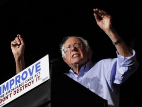 In this July 9, 2017 photo, Sen. Bernie Sanders, I-Vt., speaks during a "Care Not Cuts" rally in support of the Affordable Care Act in Covington, Ky.  House Minority Leader Nancy Pelosi is declining to endorse Sen. Bernie Sanders' universal health care bill saying that while she has long supported the idea the bill captures, of everybody getting health coverage, "Right now I'm protecting the Affordable Care Act."  (AP Photo/John Minchillo)