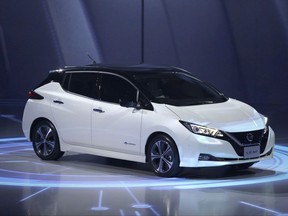 Nissan's new Leaf electric vehicle is shown during the world premiere in Chiba, near Tokyo Wednesday, Sept. 6, 2017. The zero-emissions vehicle, which Japanese automaker Nissan Motor Co. unveiled in the U.S. late Tuesday and in a Tokyo suburb Wednesday, promises a travel range of about 400 kilometers or 150 miles before needing another charge. (AP Photo/Eugene Hoshiko)