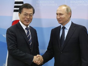 Russian President Vladimir Putin, right, shakes hands with his South Korean counterpart Moon Jae-in during their meeting at the Eastern Economic Forum in Vladivostok, Russia, on Wednesday, Sept. 6, 2017. (Mikhail Metzel/TASS News Agency Pool Photo via AP)
