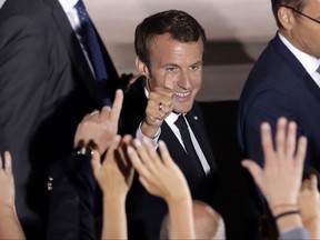 French President Emmanuel Macron waves to the crowd after his speech at Pnyx hill in Athens, Thursday, Sept. 7, 2017. Standing at a Greek site where democracy was conceived, French President Emmanuel Macron called on members of the European Union to reboot the 60-year-old bloc with sweeping political reforms or risk a "slow disintegration." (AP Photo/Thanassis Stavrakis)