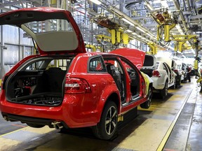 In this undated photo provided by General Motors Holden, cars are assembled on the production line in Adelaide, Australia.  The Australian auto manufacturing era ends after more than 90 years on Friday, Oct. 20, 2017 when General Motors Co.'s last Holden sedan rolls off the production line in the industrial city of Adelaide. The nation has already begun mourning the demise of a home-grown industry in an increasing crowded and changing global car market. (General Motors Holden via AP)