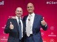 Bombardier President and CEO Alain Bellemare (left) and Airbus CEO Tom Enders gesture during a business meeting in Montreal on October 20, 2017