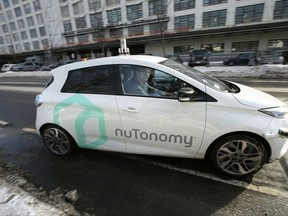 FILE - In this Tuesday, Jan. 10, 2017, file photo, an autonomous vehicle is driven by an engineer on a street in an industrial park in Boston. A new study inspired by Boston's early experiments with self-driving cars finds that the technology could ease congestion, but also lead to more cars on the road and further encourage urban sprawl. (AP Photo/Steven Senne, File)