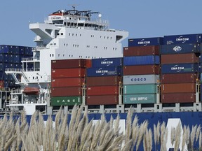 In this Wednesday, Oct. 26, 2016, photo, a container ship waits to be unloaded at the Port of Oakland, as seen from Alameda, Calif. On Thursday, Oct. 5, 2017, the Commerce Department reports on the U.S. trade gap for August. (AP Photo/Ben Margot)