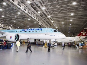 A Bombardier employees work on a CSeries 300 jets at the company's plant in Mirabel, Que., on September 28, 2017.