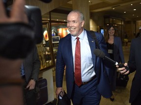 B.C. Premier John Horgan speaks to reporters following a Council of the Federation meeting in Ottawa on Oct. 3, 2017. The British Columbia New Democrat government has announced reviews or consultations on a number of issues since coming to power in July. On Monday, the NDP announced it had hired a consultant to review the issue of ride-sharing. Here's a look at the government's approach:Site C: The B.C. Utilities Commission is reviewing the hydroelectric dam project, fulfilling a promise Premier John Horgan made on the campaign trail. The utilities commission released a preliminary report on the $8.8-billion project's future last month, saying it wanted more information before determining whether Site C should proceed. THE CANADIAN PRESS/Justin Tang