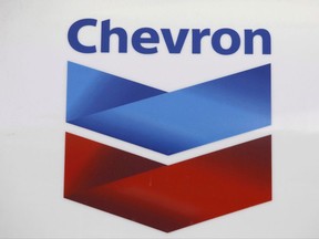 A Chevron logo appears at a gas station in Miami on July 25, 2011. Ecuadorian villagers do not need to put up almost $1 million before they can pursue a claim against oil behemoth Chevron, Ontario's top court ruled Tuesday. THE CANADIAN PRESS/AP, Lynne Sladky