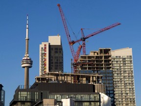 Construction cranes are seen in Toronto.