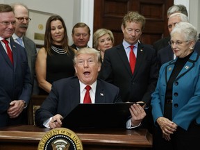 President Donald Trump speaks before signing an executive order on health care in the Roosevelt Room of the White House, Thursday, Oct. 12, 2017, in Washington. (AP Photo/Evan Vucci)