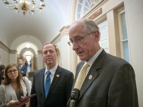 The leaders of the House Intelligence Committee, Rep. Adam Schiff, D-Calif., left, and Rep. Mike Conaway, R-Texas, emerge from a closed-door meeting at the Capitol with Sheryl Sandberg, chief operating officer of social media giant Facebook, amid the company's discovery of Russia-linked ads that ran before and after the 2016 election, in Washington, Wednesday, Oct. 11, 2017. (AP Photo/J. Scott Applewhite)
