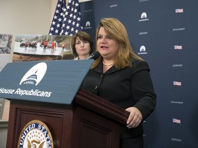 Del. Jenniffer Gonzalez, D-Puerto Rico, joined at left by Rep. Cathy McMorris Rodgers, R-Wash., talks about hurricane damage in Puerto Rico, at the Capitol in Washington, Wednesday, Oct. 11, 2017. Speaker of the House Paul Ryan, R-Wis., will visit Puerto Rico this week. (AP Photo/J. Scott Applewhite)
