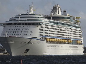 FILE - In this Oct. 3, 2017, file photo, The Royal Caribbean Adventure of the Seas, arrives at Port Everglades in Fort Lauderdale, Fla. Royal Caribbean has announced that its ship Adventure of the Seas will resume port calls to St. Thomas on Nov. 10, and that the ship hopes to be in San Juan, Puerto Rico, and St. Martin by the end of November. It's one of a number of initiatives from the travel industry to remind consumers that the region is recovering from the impact of recent hurricanes. (Joe Cavaretta/South Florida Sun-Sentinel via AP, File)