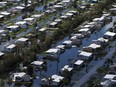 This aerial photo shows flooded homes of Citrus Park in Bonita Springs, Fla., six days after Hurricane Irma.
