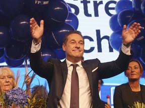 Hans-Christian Strache, leader of the strongly eurosceptic Austrian Freedom Party, waves to his supporters in Vienna, Austria, Sunday, Oct. 15, 2017, after the closing of the polling stations for the Austrian national elections. (AP Photo/Ronald Zak)