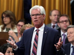 Natural Resources Minister Jim Carr stands during Question Period in the House of Commons in Ottawa, Tuesday, October 3, 2017. THE CANADIAN PRESS/Fred Chartrand