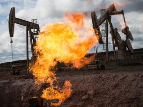 A gas flare is seen at an oil well site when excess flammable gases are released during drilling.