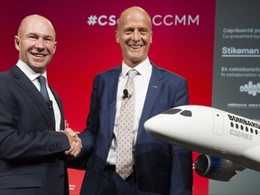 Bombardier President and CEO Alain Bellemare, left, shakes hands with Airbus CEO Tom Enders shake hands during a business meeting in Montreal, Friday, October 20, 2017. THE CANADIAN PRESS/Graham Hughes