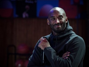 Former NBA basketball player Kobe Bryant attends a promotional event organized by the sports brand Nike, for the inauguration of the infrastructure improvements of a local basketball playground at the Jean-Jaures sports hall "Le Quartier" in Paris on October 21, 2017