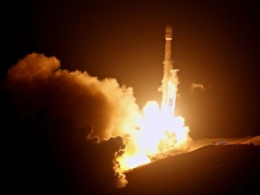 A SpaceX Falcon 9 rocket is launched from the Space Launch Complex-4 at Vandenberg Air Force Base, Calif., on Monday, Oct. 9, 2017. Ten new satellites for Iridium Communications Inc. have been carried into orbit by a SpaceX Falcon 9 rocket launched from California. The booster lifted off from coastal Vandenberg Air Force Base before dawn Monday and its first stage successfully returned from space and set down on a landing platform floating in the Pacific Ocean as the second stage went on to deploy the satellites in orbit. (Matt Hartman via AP)