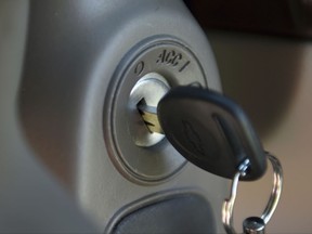 FILE - This April 1, 2014, file photo shows a key in the ignition switch of a 2005 Chevrolet Cobalt in Alexandria, Va., one of many parts recalled by General Motors more than a decade after the company knew about defects. General Motors has agreed to a $13.9 million settlement with Orange County, Calif., after prosecutors accused the auto giant of concealing serious safety defects to avoid costly recalls and part replacements. (AP Photo/Molly Riley, File)