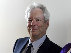 FILE - In this June 22, 2014 file photo US economist Richard Thaler poses for a photo during the award ceremony for the world economy prize in Kiel, Germany. The Nobel economics prize has been awarded to Thaler of the University of Chicago for his contributions to behavioral economics. (Carsten Rehder/dpa via AP, file)