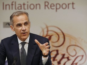 FILE - A Thursday, Aug. 3, 2017 file photo, Bank of England Governor Mark Carney, addresses the media during a press conference to deliver the quarterly inflation report in London. The Bank of England seems set to raise interest rates for the first time in a decade on upcoming Thursday, attempting to tackle rising inflation, according to suggestions signalled by bank governor Mark Carney.(AP Photo/Frank Augstein, FILE)