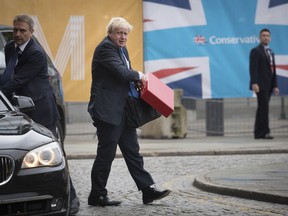 Britain's Foreign Secretary Boris Johnson arrives at the Conservative Party Conference at the Manchester Central Convention Complex in Manchester, England, Sunday, Oct. 1, 2017. (Stefan Rousseau/PA via AP)