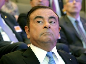 Renault Group CEO Carlos Ghosn attend a media conference at La Defense business district, outside Paris, France, Friday, Oct. 6, 2017. French carmaker Renault says half of its models will be electric or hybrid by 2022 and it's investing heavily in "robo-vehicles" with increasing degrees of autonomy. (AP Photo/Michel Euler)