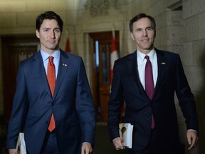 Prime Minister Justin Trudeau, left and finance minister Bill Morneau will announce today changes to the tax reform proposals in a bid to re-establish the Liberals as the champions of middle-class Canadians.