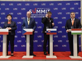 From left to right: Prime Ministers Beata Szydlo of Poland, Bohuslav Sobotka of Czech Republic, Robert Fico of Slovakia and Viktor Orban of Hungary  attend the joint press conference after the Summit on Equal Quality of Products for All at the Bratislava Castle in Bratislava, Slovakia, Friday, Oct. 13, 2017. The meeting of representatives of the European Commission and EU Agriculture Ministers will be on a 'double standards of food quality' in the European Union. (Tibor Illyes/MTI via AP)