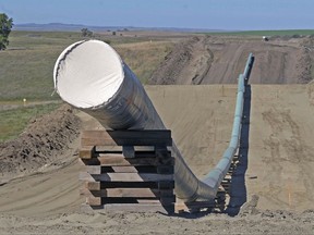 FILE - This Sept. 29, 2016, file photo, shows a section of the Dakota Access pipeline under construction near St. Anthony in Morton County, N.D. A federal judge ruled Wednesday, Oct. 11, 2017, that the Dakota Access oil pipeline can continue operating while a study is completed to assess its environmental impact on the Standing Rock Sioux. (Tom Stromme/The Bismarck Tribune via AP, file)