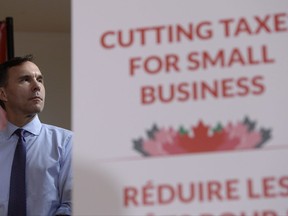 Finance Minister Bill Morneau looks on at a press conference on tax reforms in Stouffville, Ont., on Monday, October 16, 2017. THE CANADIAN PRESS/Nathan Denette