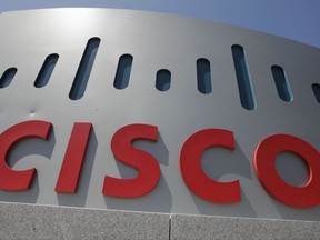 FILE - This Wednesday, May 9, 2012, file photo, shows an exterior view of Cisco Systems Inc. headquarters in Santa Clara, Calif. Cisco is buying BroadSoft for $1.9 billion in a move to bolster telecom technology. The deal is expected to close during the first quarter of 2018. (AP Photo/Paul Sakuma, File)