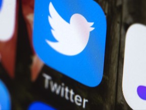 This Wednesday, April 26, 2017, photo shows the Twitter app on a mobile phone in Philadelphia. Twitter says it will ban ads from RT and Sputnik, two state-sponsored Russian news outlets that the U.S. intelligence community has said tried to interfere with the 2016 U.S. presidential election. (AP Photo/Matt Rourke)