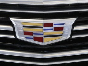 FILE - This Thursday, Feb. 11, 2016, file photo shows the Cadillac logo, a General Motors Co. brand, on display on a vehicle at the Pittsburgh International Auto Show in Pittsburgh. General Motors Co. reports earnings Tuesday, Oct. 24, 2017. (AP Photo/Gene J. Puskar, File)