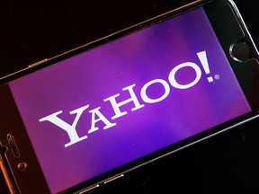 FILE - In this Dec. 15, 2016, file photo, the Yahoo logo appears on a smartphone in Frankfurt, Germany. On Tuesday, Oct. 3, 2017, Yahoo tripled down on what was already the largest data breach in history, saying it affected all 3 billion of its users, not the 1 billion it revealed in late 2016. (AP Photo/Michael Probst, File)