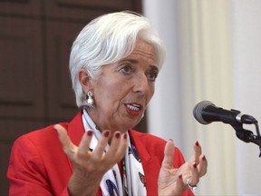 FILE - In this Monday, Sept. 11, 2017, file photo, International Monetary Fund Managing Director Christine Lagarde answers a reporter's question during a news conference in Seoul, South Korea. On Tuesday, Oct. 10, 2017, the IMF issues its world economic outlook for 2017 and 2018. (AP Photo/Lee Jin-man, File)