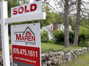 FILE - This Tuesday, May 24, 2016, file photo shows a "Sold" sign in front of a house in Andover, Mass. On Tuesday, Oct. 31, 2017, the Standard & Poor's/Case-Shiller 20-city home price index for August is released. (AP Photo/Elise Amendola, File)