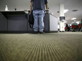FILE - In this Friday, March 10, 2017, file photo, a lone job seeker checks in at the front desk of the Texas Workforce Solutions office in Dallas. On Thursday, Oct. 19, 2017, the Labor Department reports on the number of people who applied for unemployment benefits a week earlier. (AP Photo/LM Otero, File)