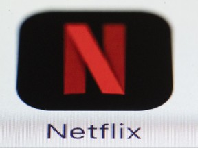 This Monday, July 17, 2017, photo shows the Netflix logo on an iPhone. On Thursday, Oct. 5, 2017, Netflix announced it is raising the price for its most popular U.S. video streaming plan by 10 percent in a move that may boost its profits, but slow the subscriber growth that drives its stock price. (AP Photo/Matt Rourke)