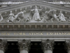 FILE - This Thursday, Oct. 2, 2014, file photo, shows the facade of the New York Stock Exchange. U.S. stocks were up slightly in early trading Friday, Oct. 20, 2017, as investors cheered a crop of strong company earnings. (AP Photo/Richard Drew, File)