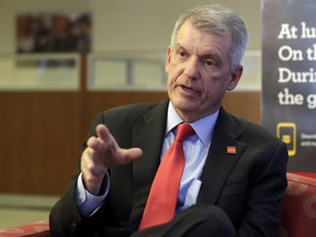 FILE- In this March 17, 2017, file photo, Wells Fargo CEO & President Timothy Sloan is interviewed in one of his bank's branches, in New York. According to prepared comments from Sloan, he will face Congress saying the bank remains "deeply sorry" for its previous sales practices, and that in the year since the scandal over them exploded it has substantially changed for the better. The comments from Sloan come ahead of his scheduled appearance in front of the Senate Banking Committee on Tuesday, Oct. 3, about a year since his predecessor did the same and was grilled about the sales practices. (AP Photo/Richard Drew, File)