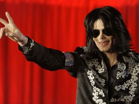 FILE - In this March 5, 2009, file photo, Michael Jackson appears at an event to announce a series of concerts in London. Forbes announced on Oct. 30, 2017, that Jackson topped its list of highest-earning dead celebrities. (AP Photo/Joel Ryan, File)